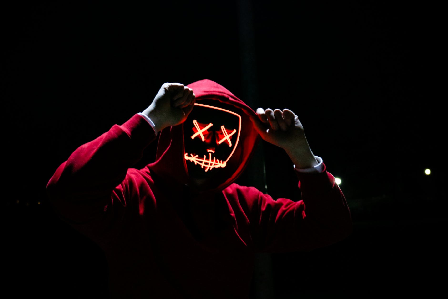 Person wearing red hoodie for red rubber.