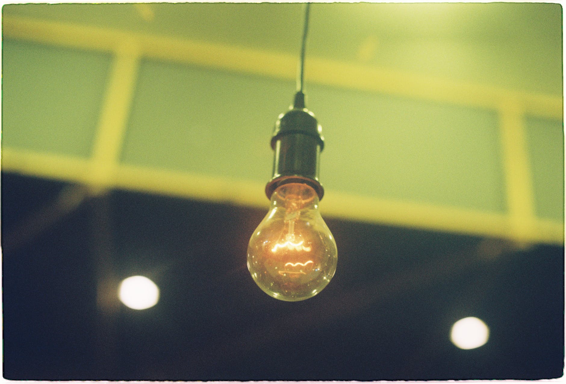 a hanging incandescent light bulb